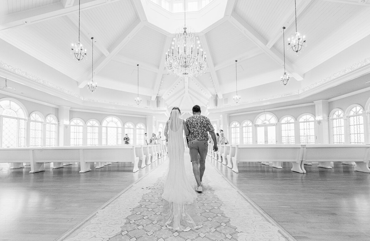 bride walking down aisle at Disney Wedding Pavilion