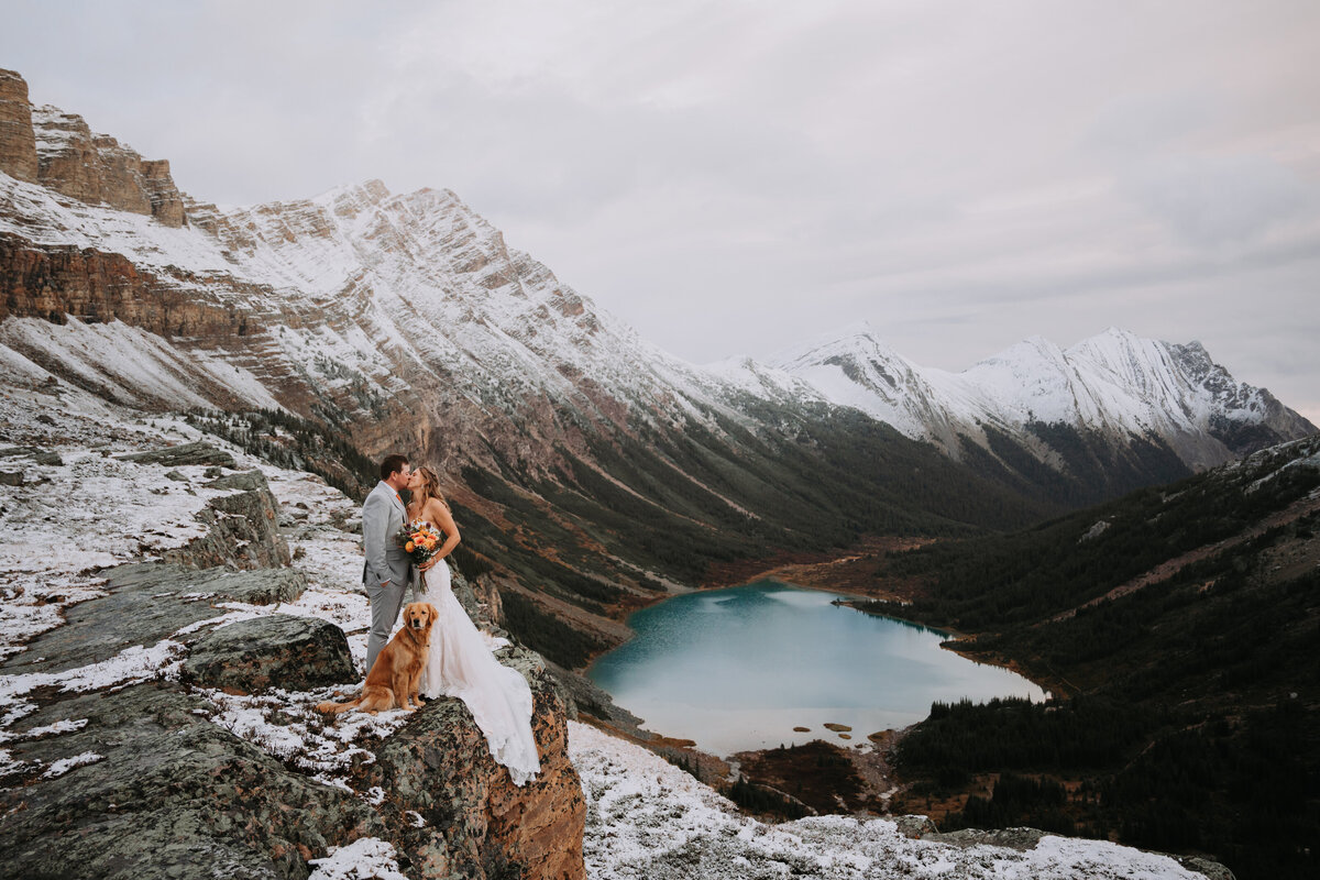 couple eloping on top of a mountain in banff