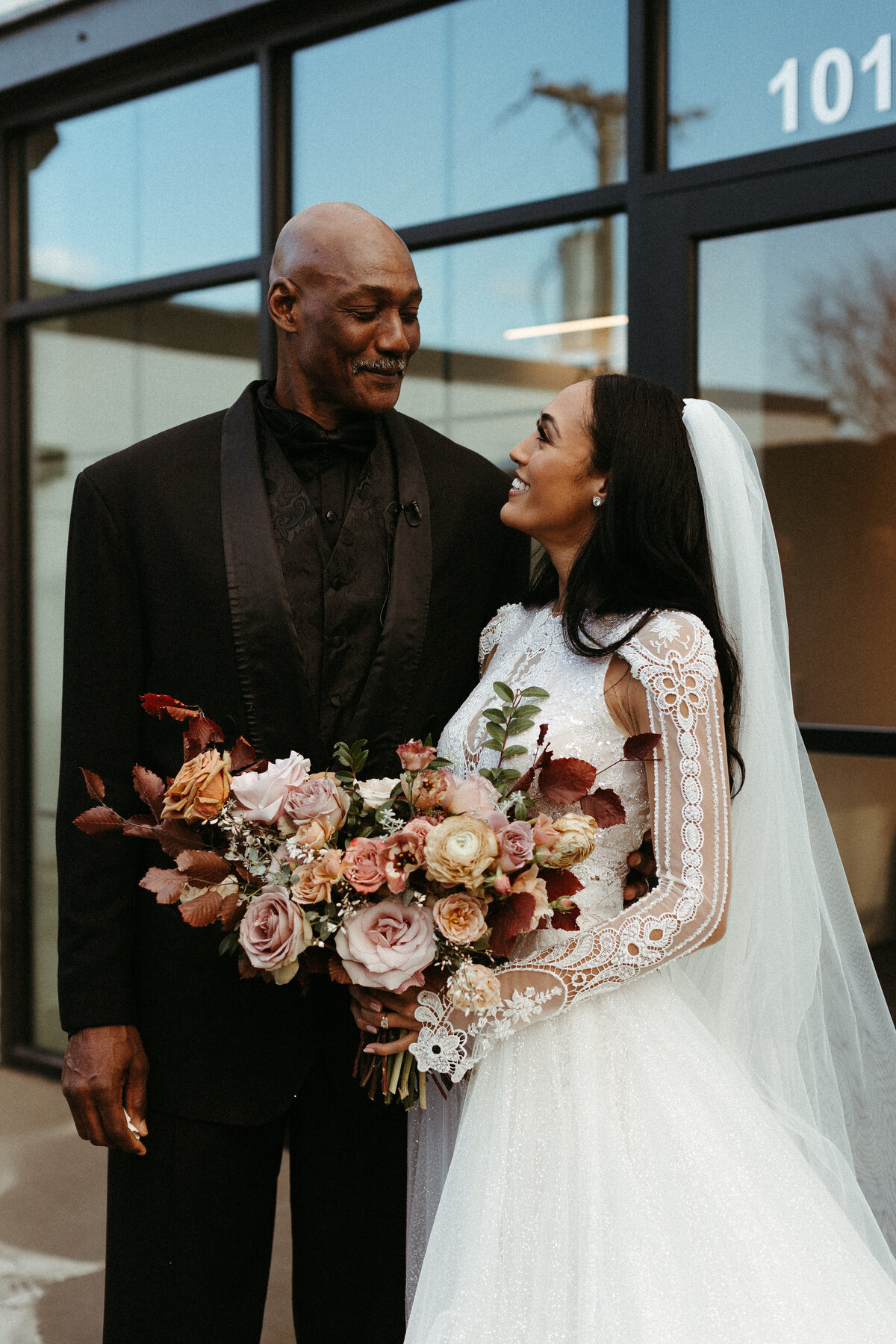 This elegant bridal bouquet brought hues of mauve, dusty pink, cream, burgundy, and terra cotta to this winter wedding. Lush with petal heavy roses, ranunculus, spray roses, copper beech, and greenery. Designed by Rosemary and Finch in Nashville, TN.