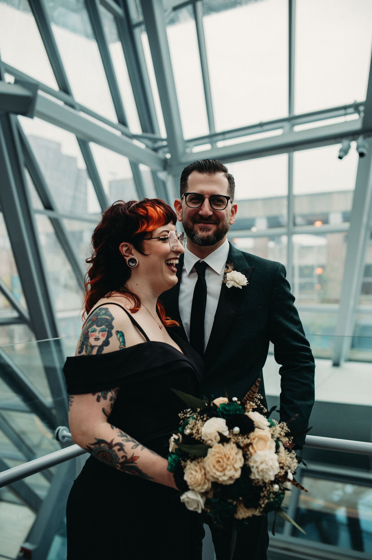 Partners smile as they pose inside museum in Ohio.