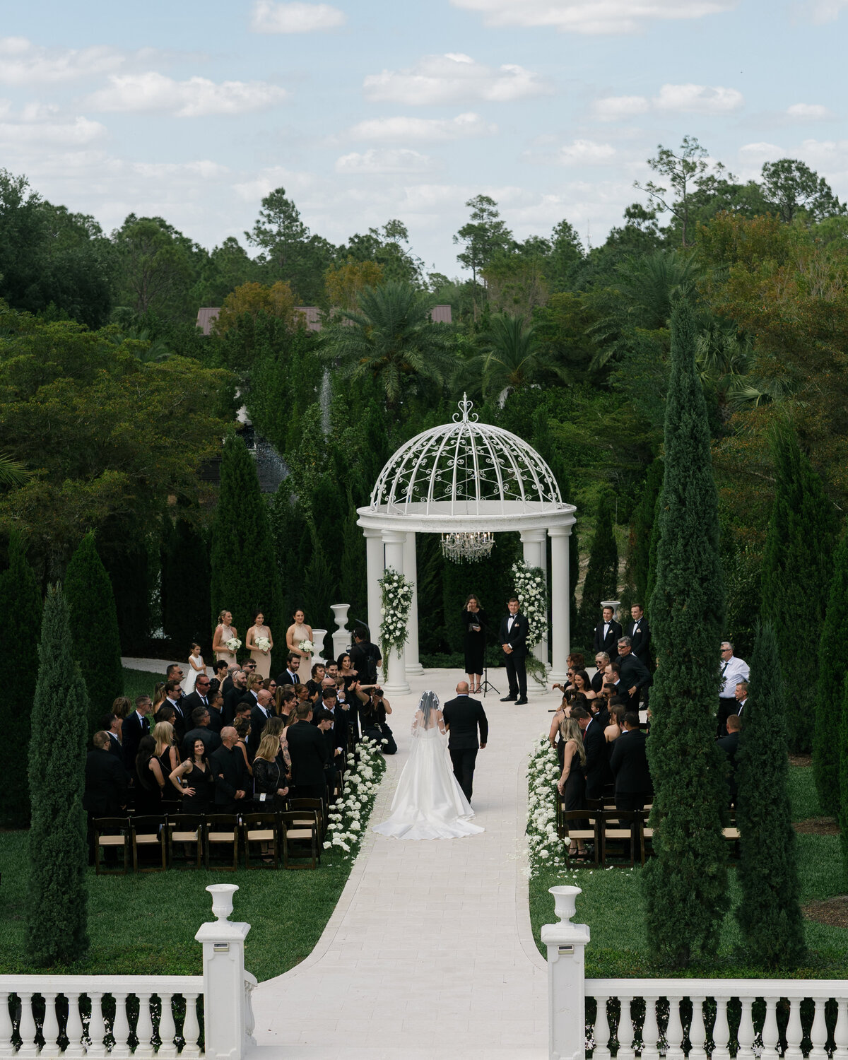 Bride walking down aisle at La Casa Toscana