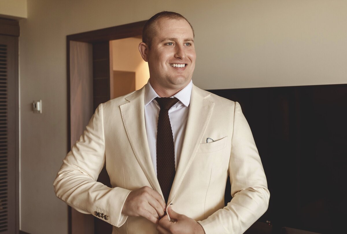 Groom getting ready for wedding in Riviera Maya