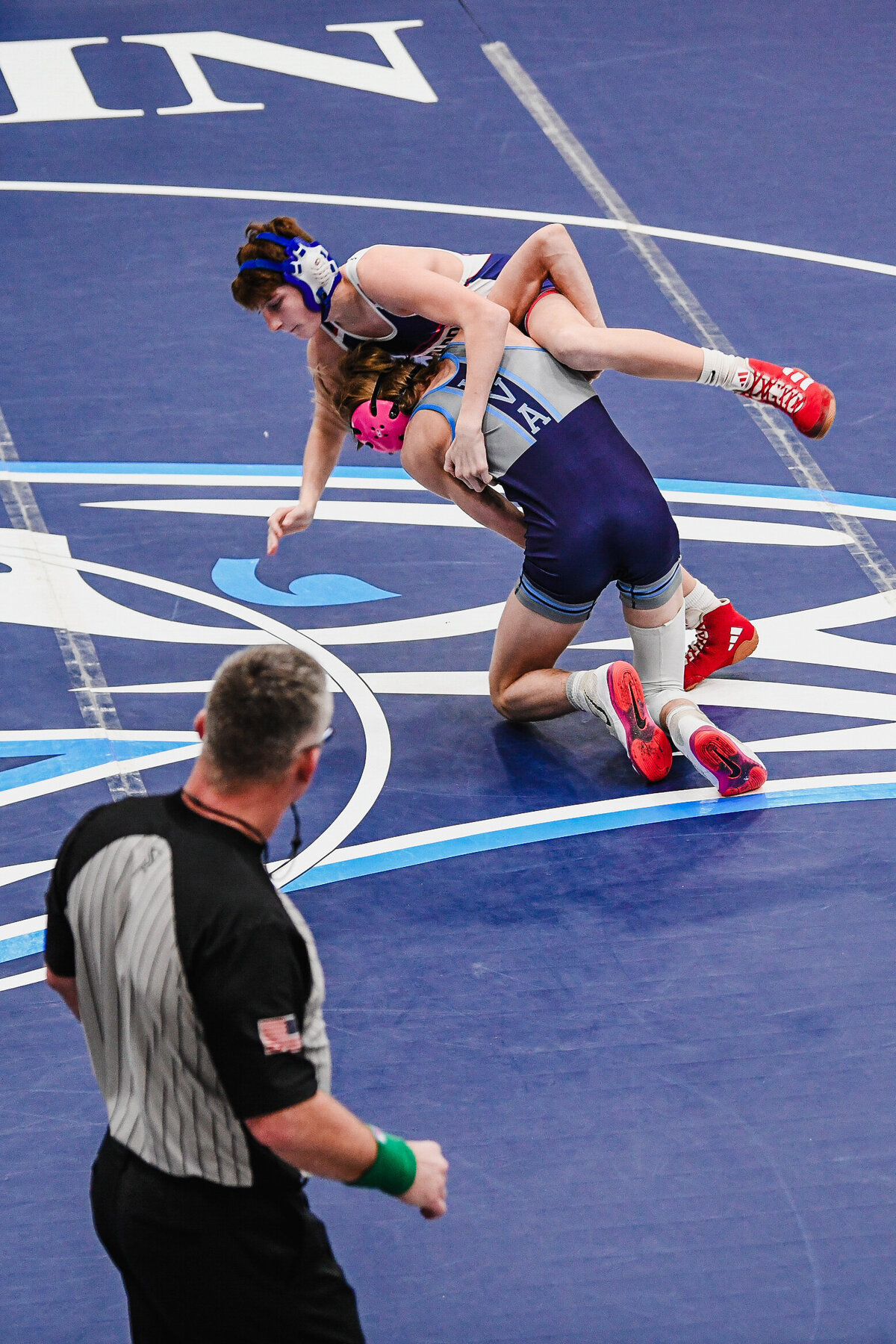 a wrestler takes down his opponent in Knoxville