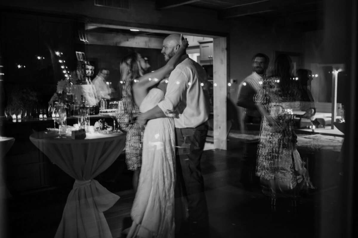 A sweet candid moment of a bride and groom dancing captured by Fort Worth wedding photographer, Megan Christine Studio