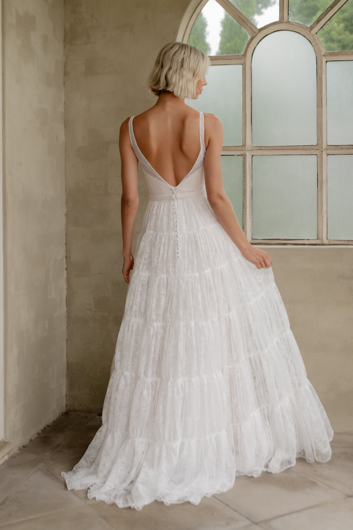 Back of boho wedding dress by Window