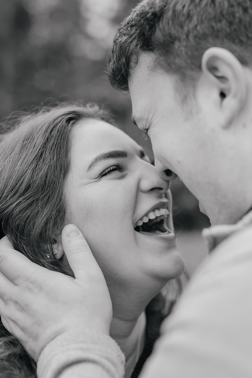 Female laughing lovingly at her fiance