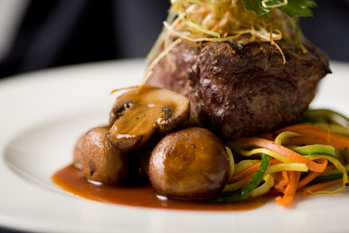 Surf and turf with shrimp, steak, and vegetables