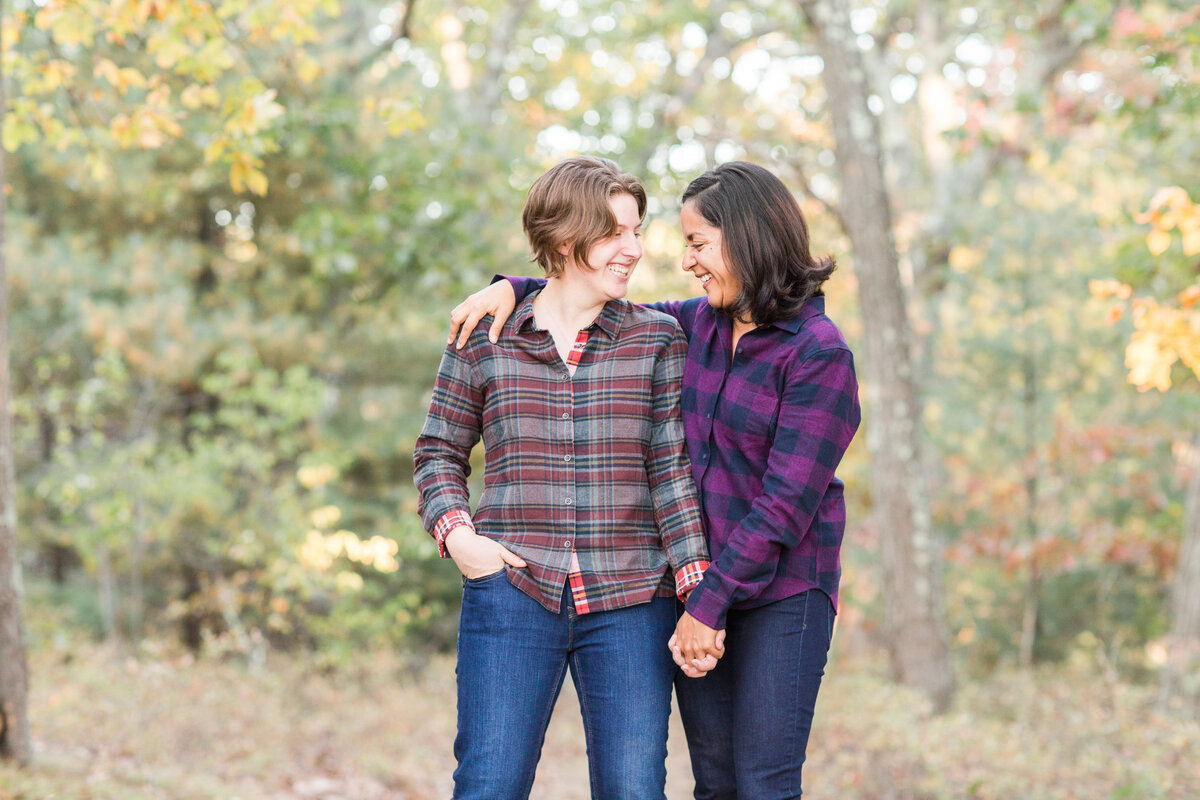 two women touching foreheads during engagement session