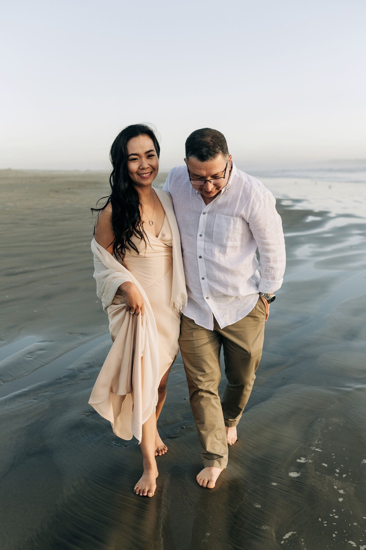 couple walk beach christchurch sunset gown white shirt chinos ocean happy summer