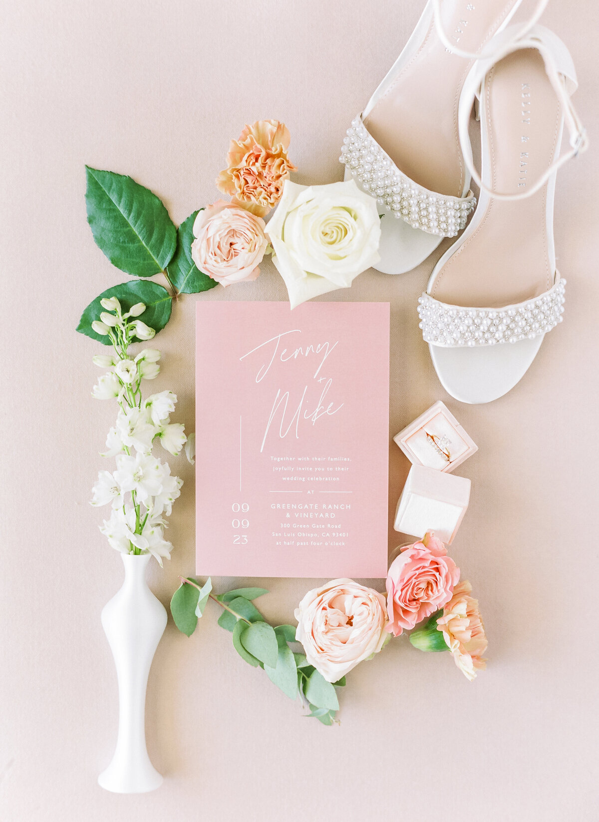 wedding invitation flatlay with florals