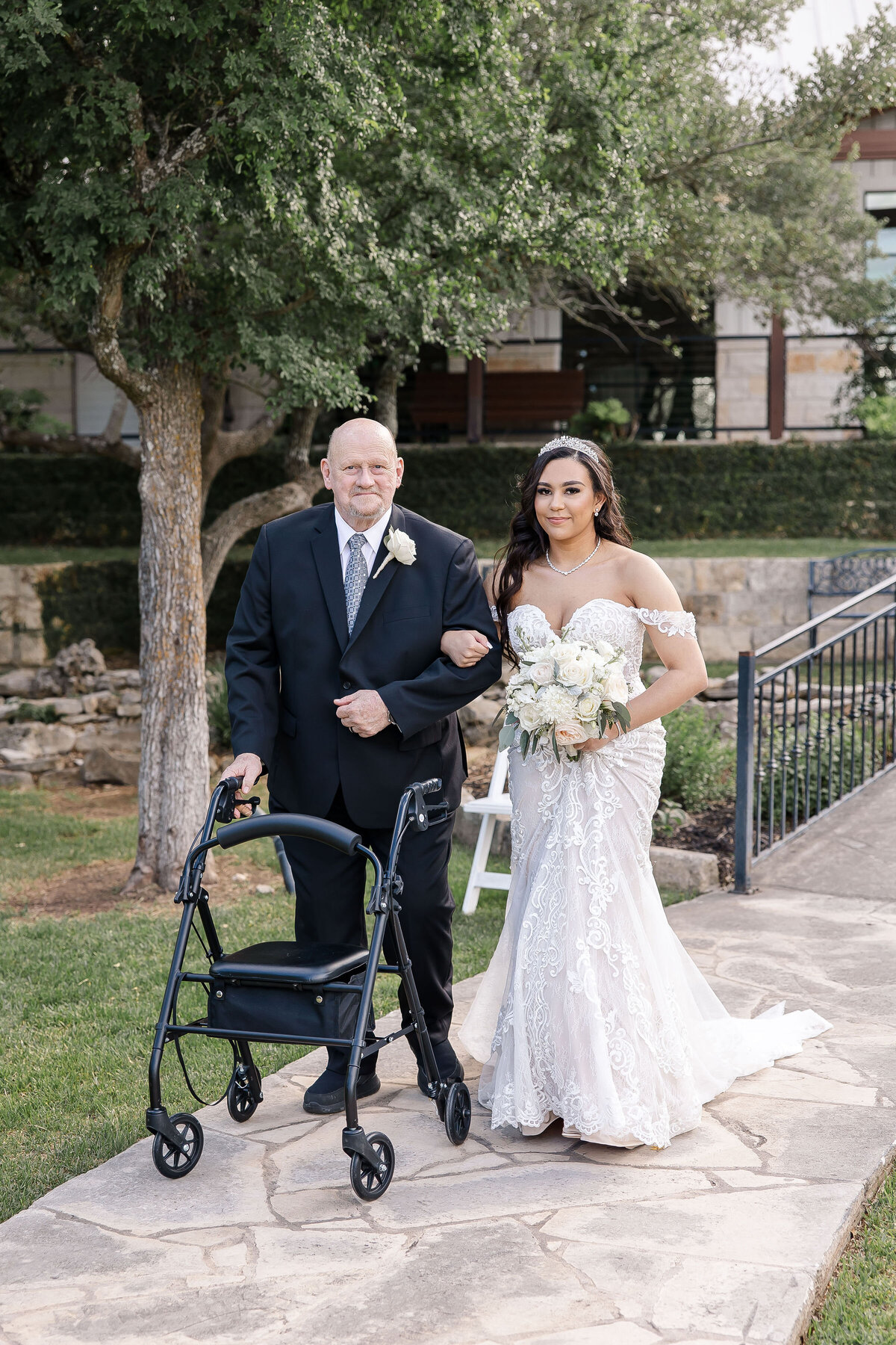 grandfather with walker leads bride down aisle at outdoor Milestone New Braunfels wedding
