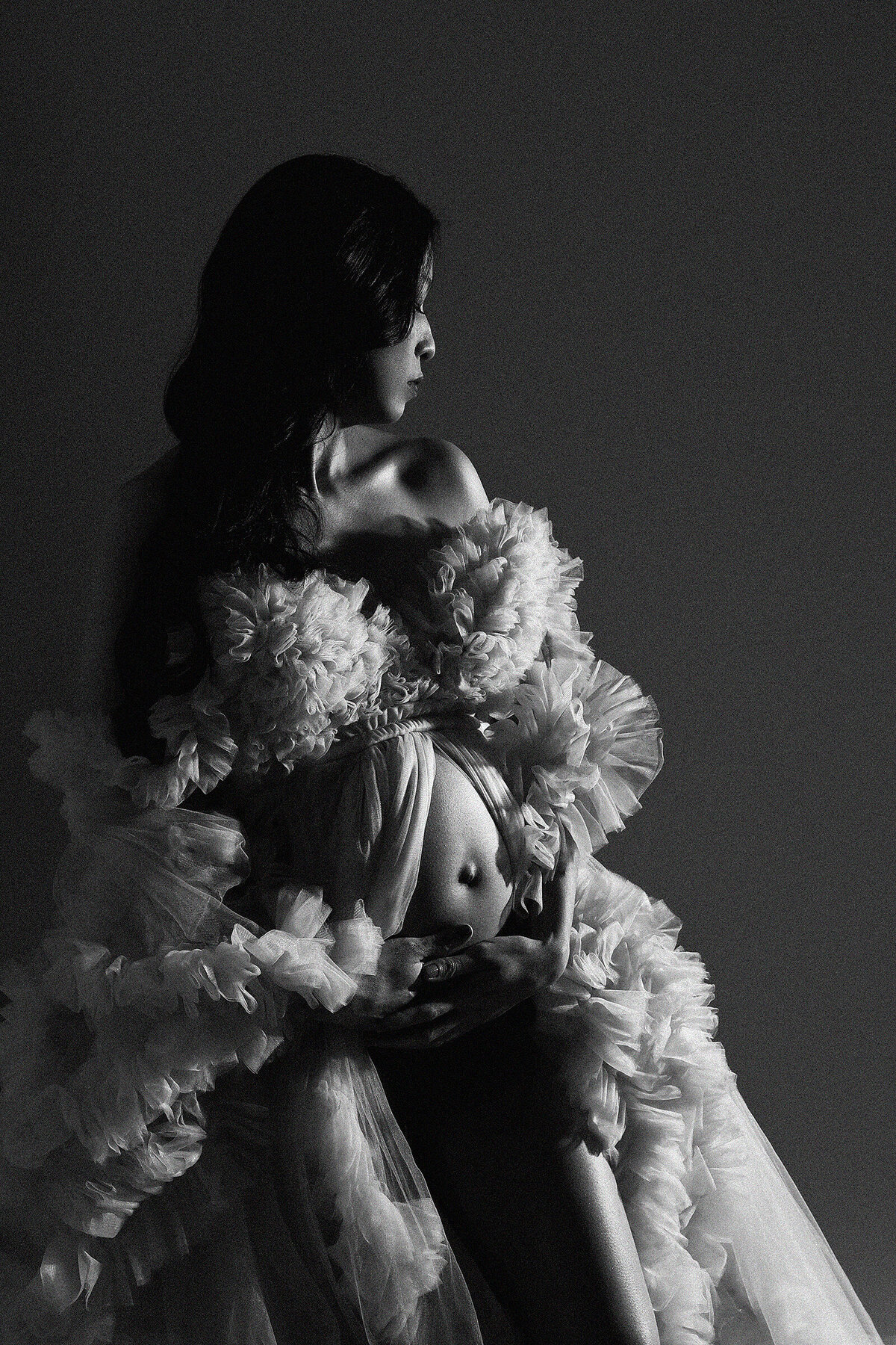 maternity photographer mom to be posed in a gown black and white fashion