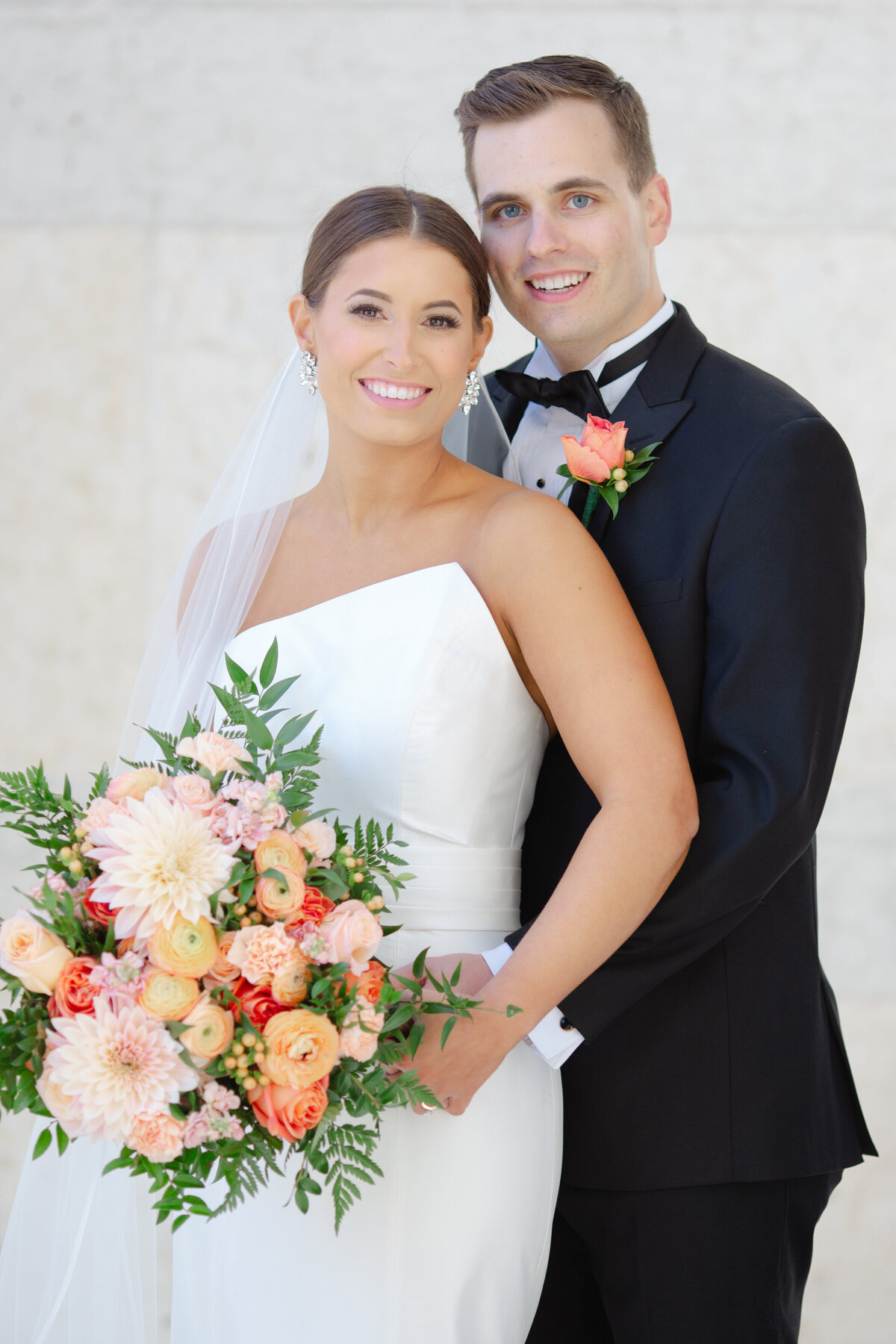 bride and groom smile on the Capital square in Columbus ohio