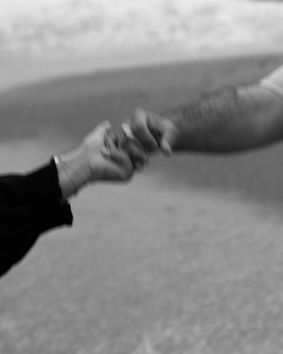 couples hands at engagement shoot in California