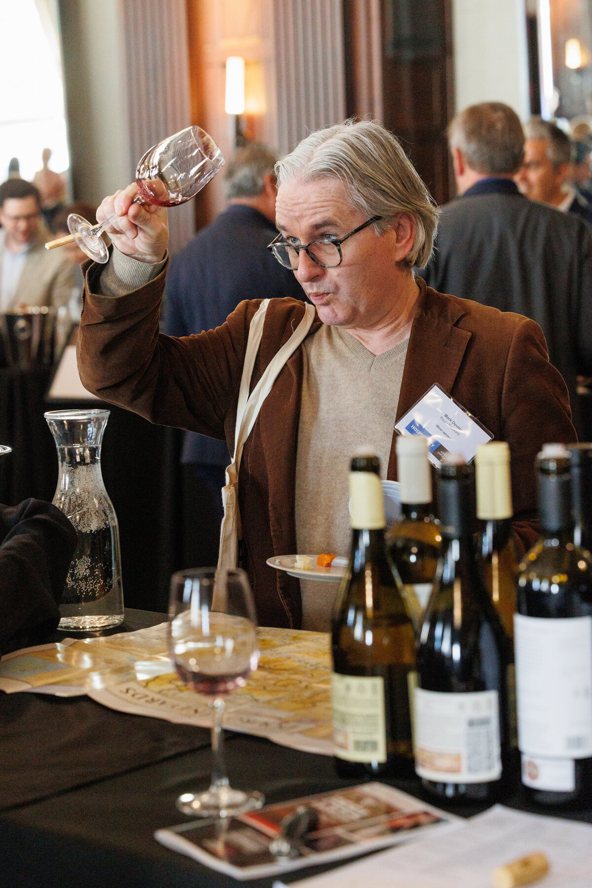 Male looking at a glass of wine