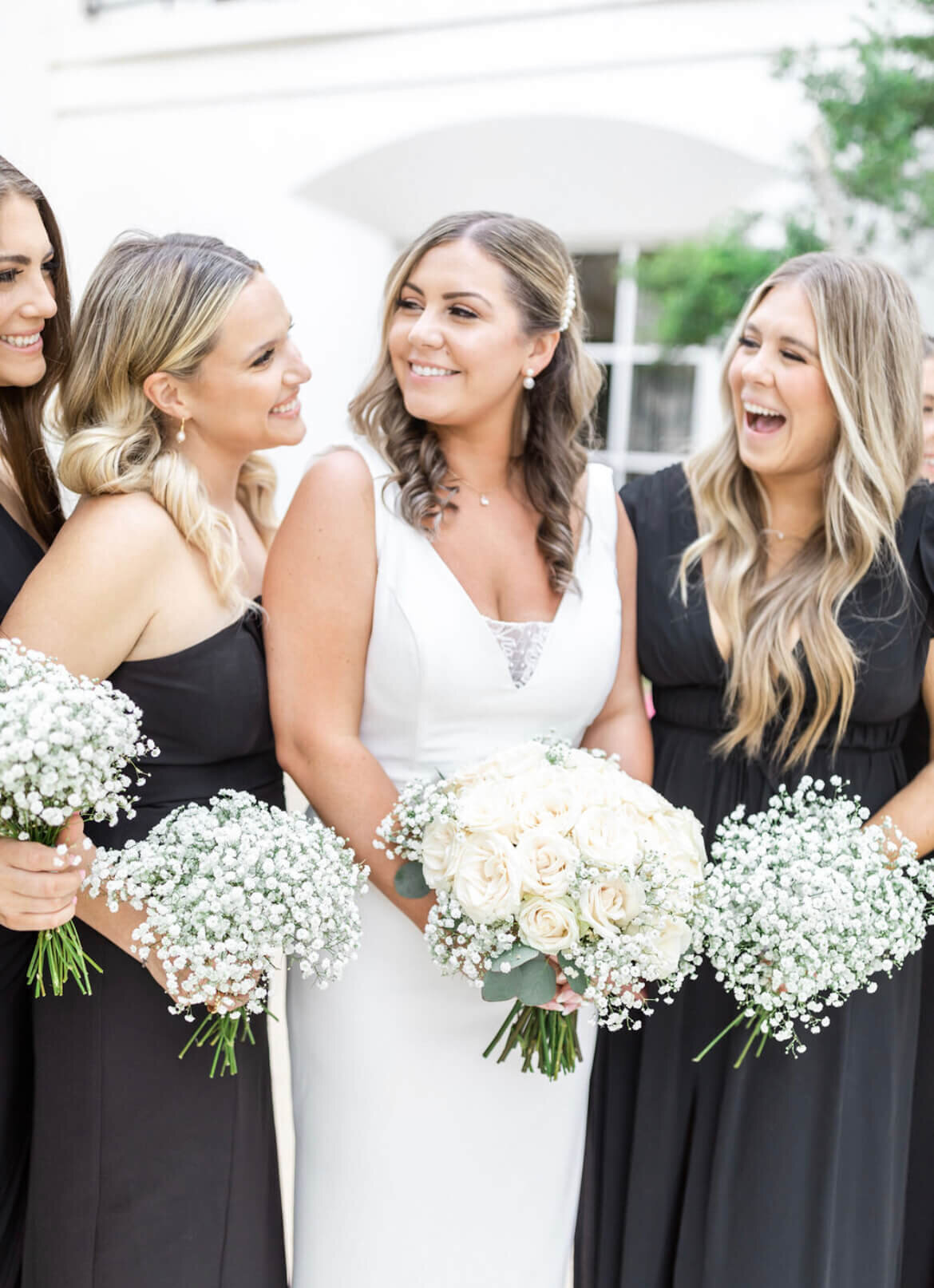 This radiant bride and her bridesmaids show off soft curls, glowing makeup, and flawless skin—perfectly styled by Mistique Makeup’s bridal beauty team. Our San Antonio and Austin salons provide professional wedding hair and makeup services for every member of the bridal party.