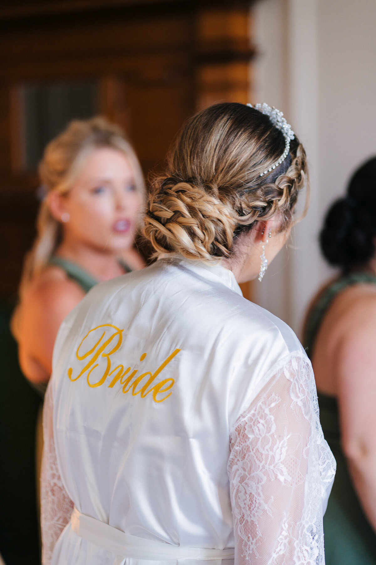 Bride with bridesmaids at Merewood Country House Hotel in the Lake District taken by documentary photographer Anthony  Horseman