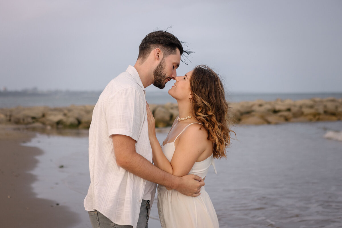 A couple hugging on the beach