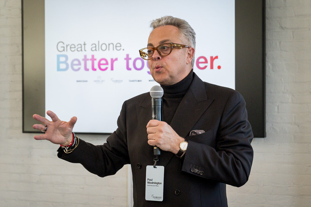 corporate keynote speaker business nj
Alt: Corporate event photography of speaker in suit presenting passionately to