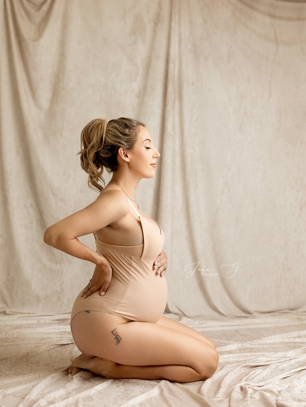 Vancouver  Photographer  photographs a women posing in a body suit during a photoshoot