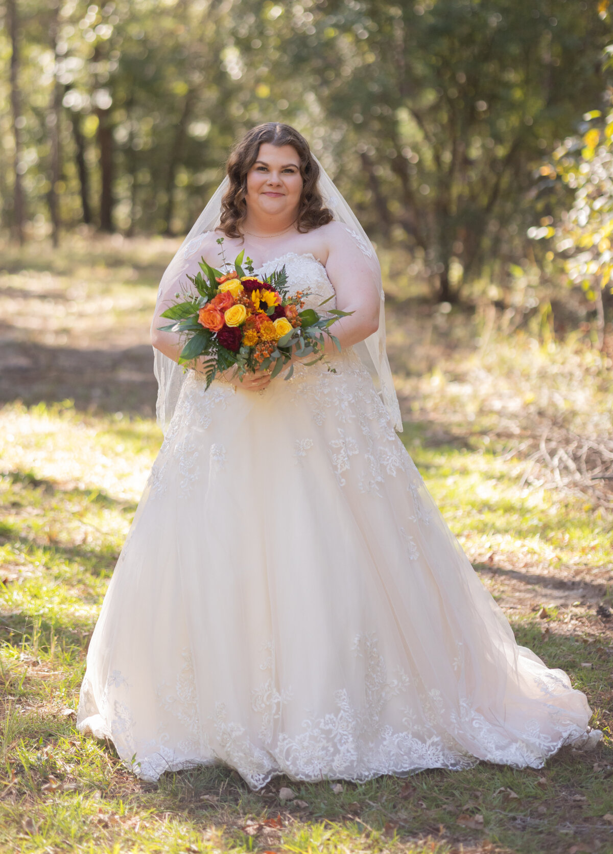 bride-holding-bouquet-at-the-hidden-cabin-seale-alabama