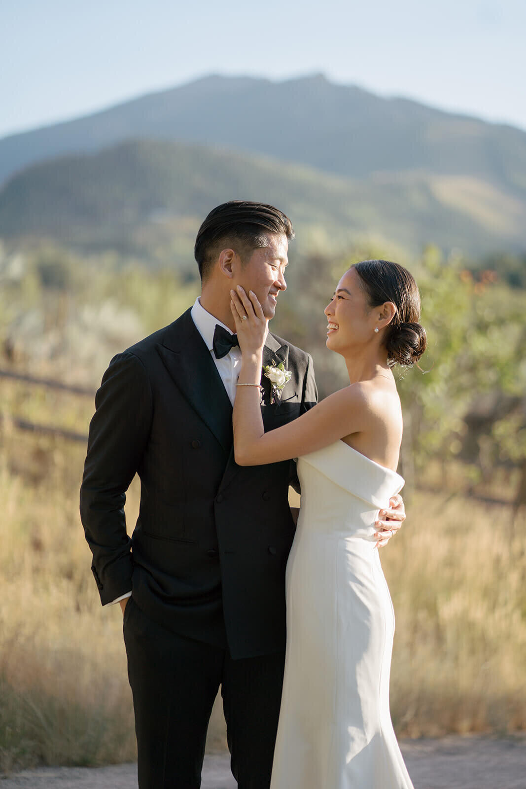 Bride and Groom share an intimate moment after their wedding ceremony at the Aspen Meadows Resort outdoor colorado wedding venue.