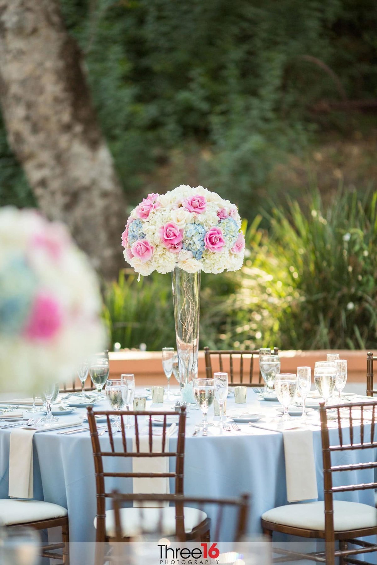 Tall centerpiece on a wedding reception table