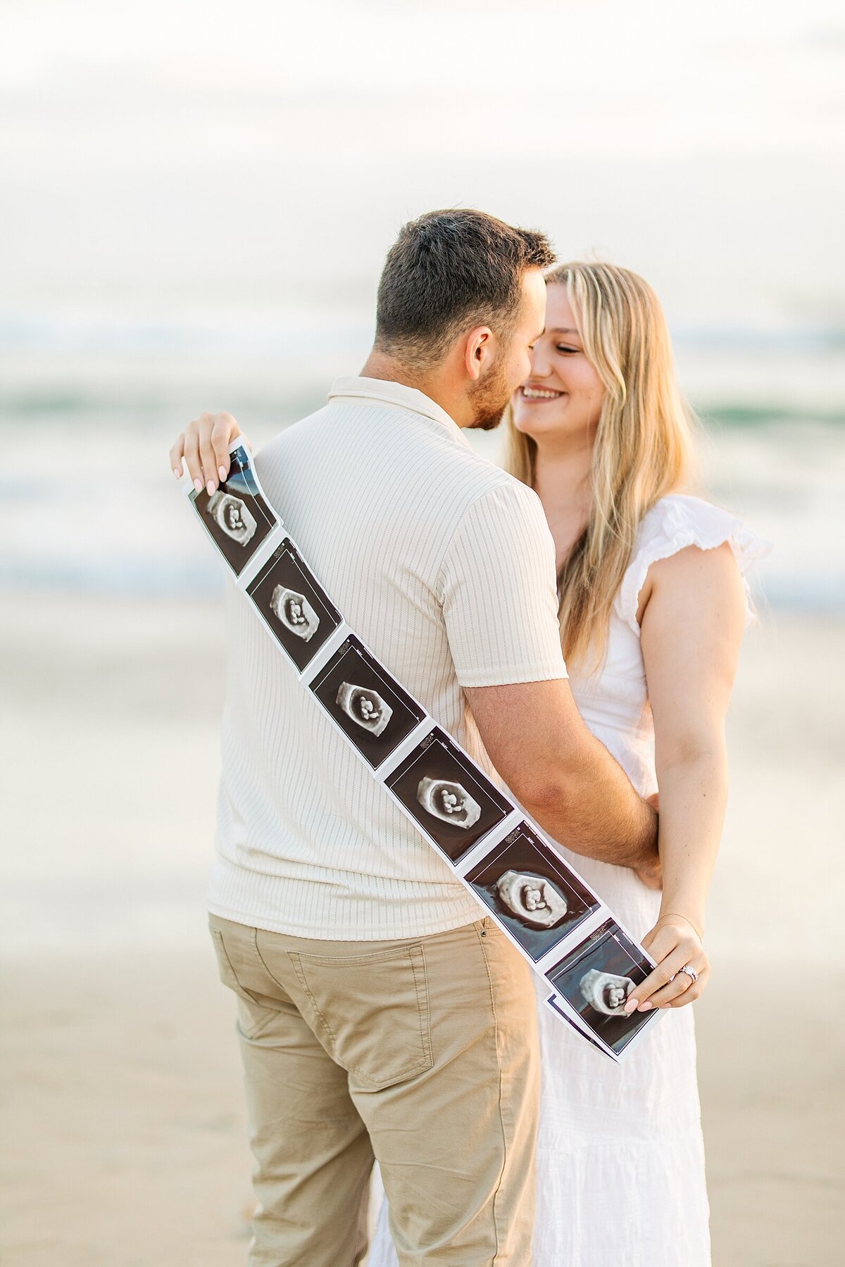 Pregnancy announcement photo and video shoot at Del Mar Beach.