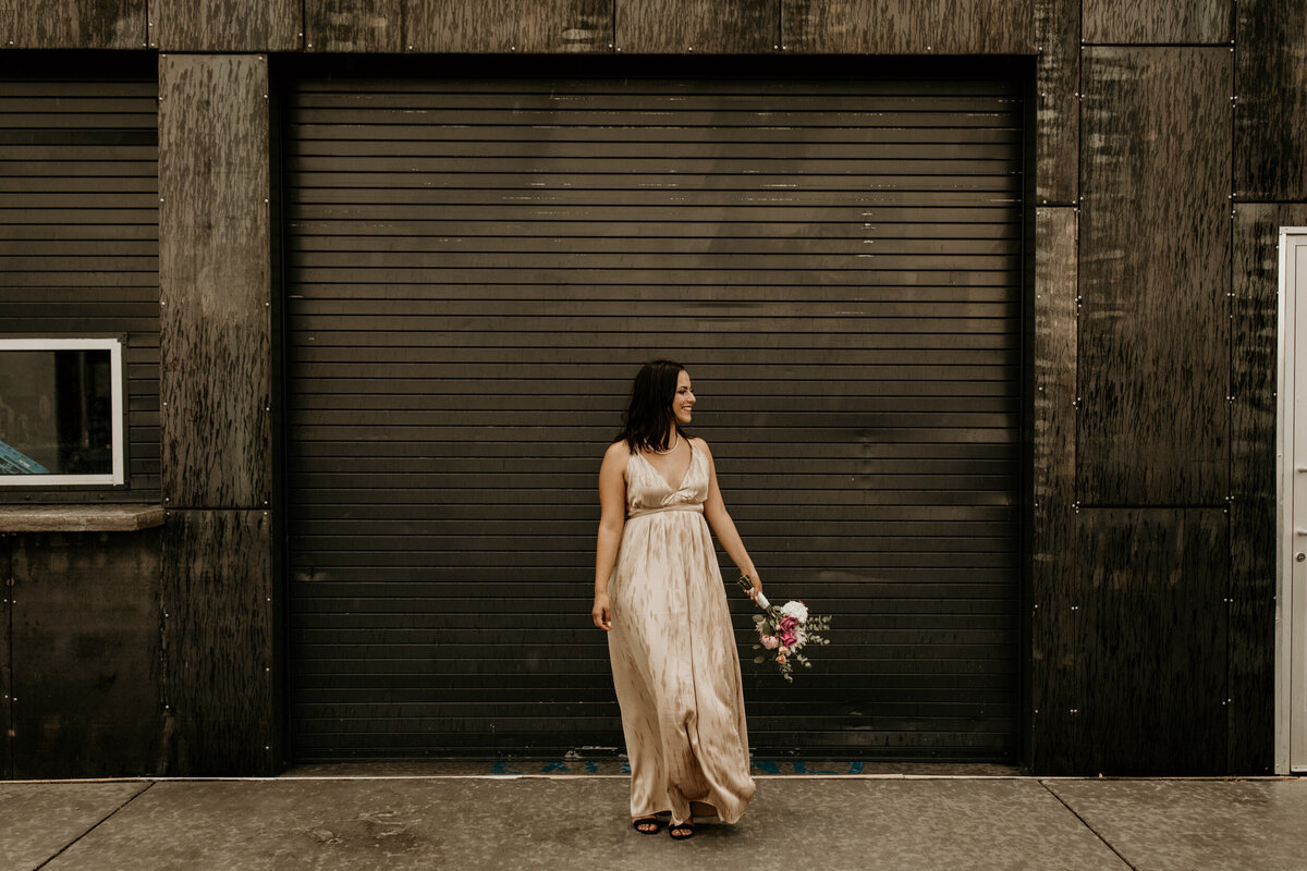 bride standing in front of a black door in downtown Albuquerque