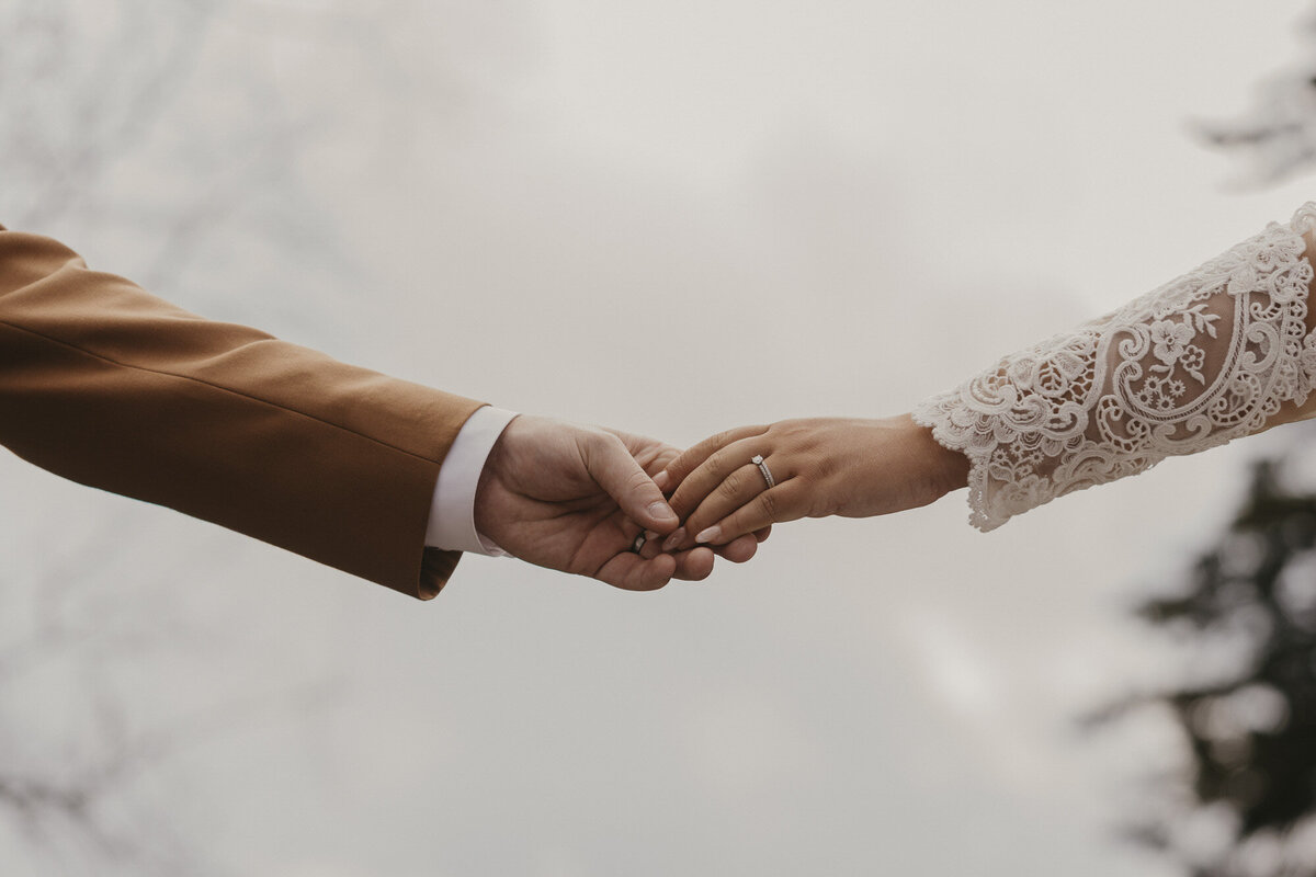 Bride and groom holding hands