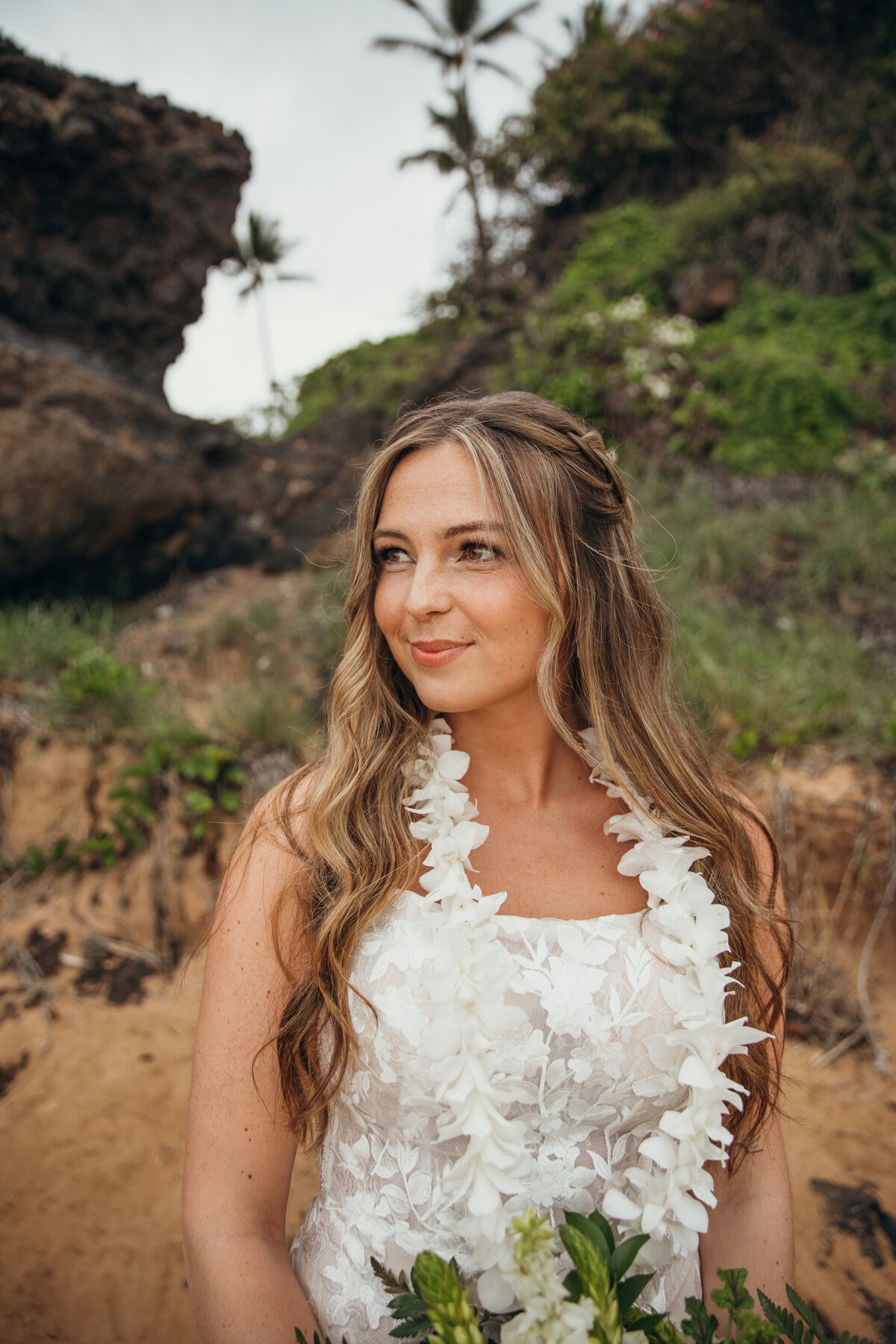 Maui Wedding Photographer captures bride wearing lei during bridal portraits