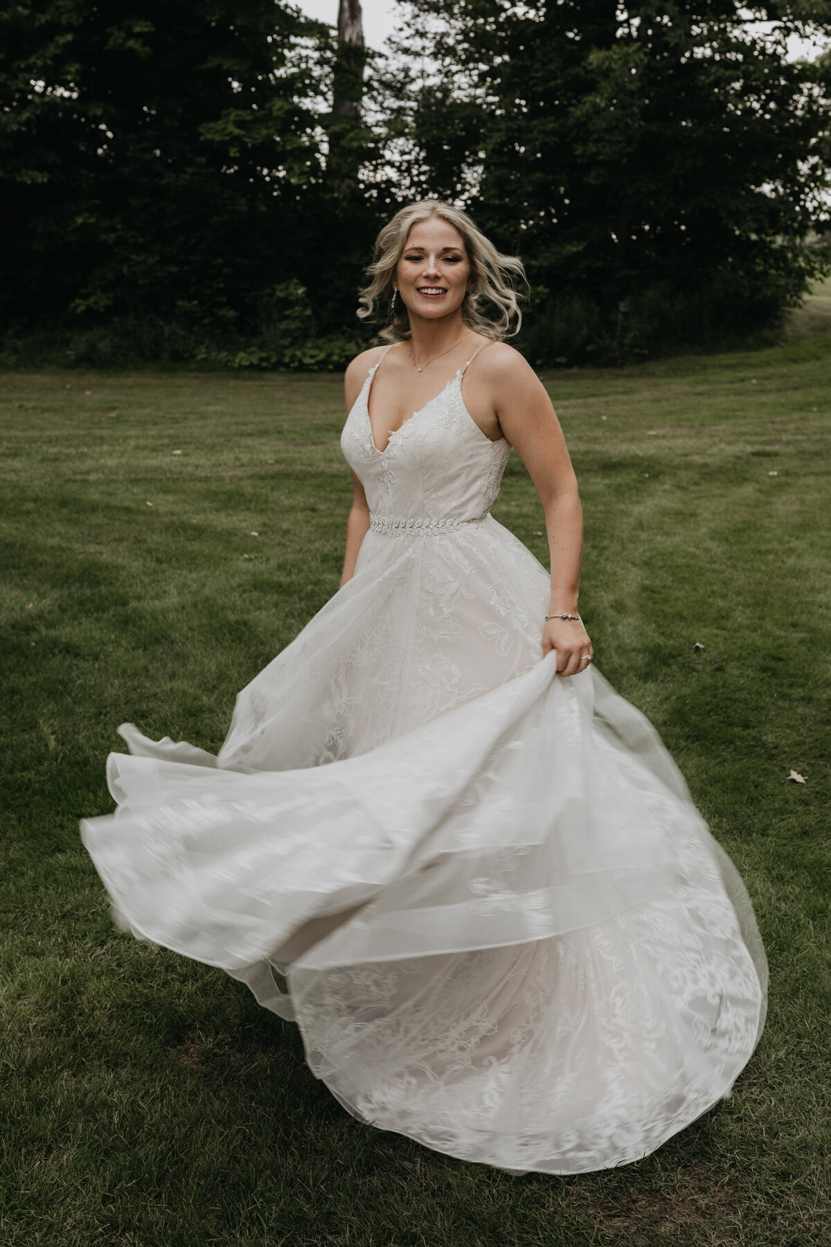 Bride twirling in dress