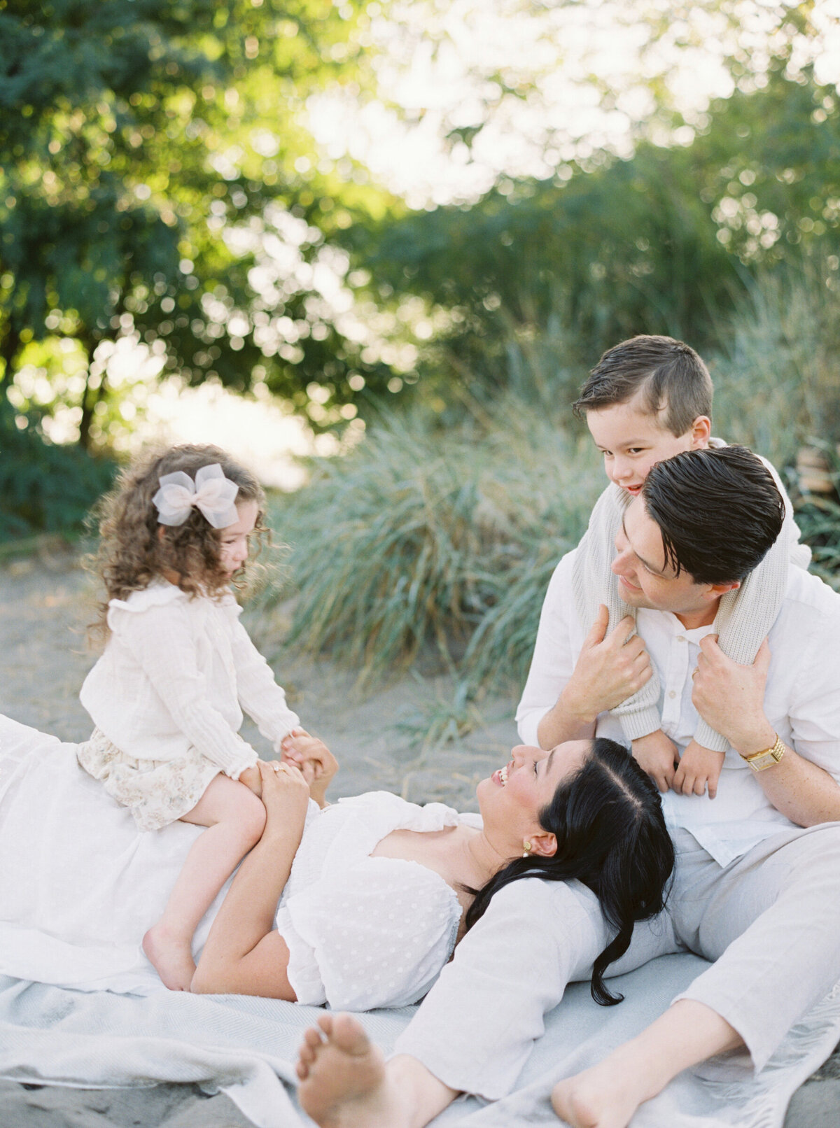 family-lounging-together-beach-seattle