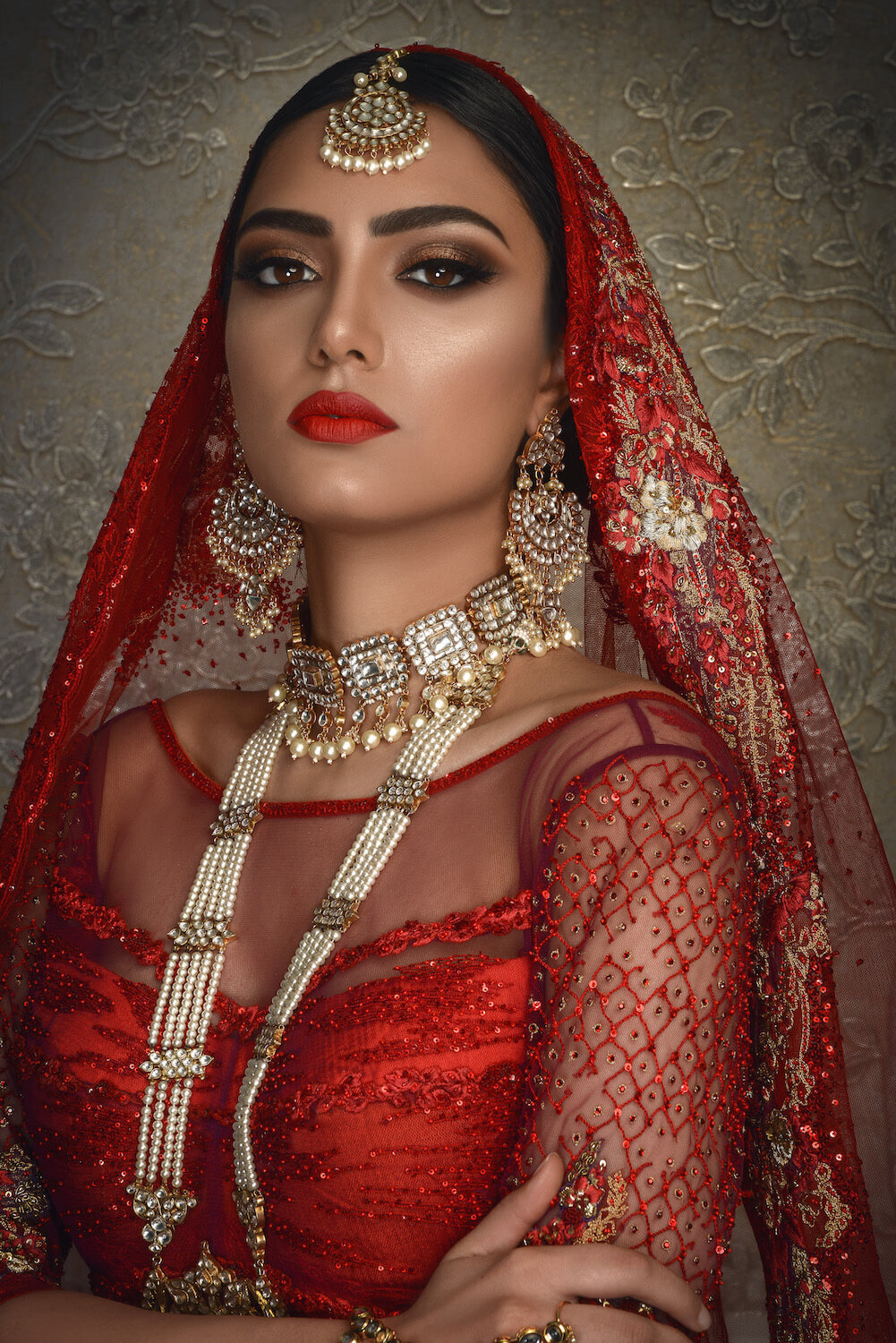 Beautiful bride wearing a red wedding outfit