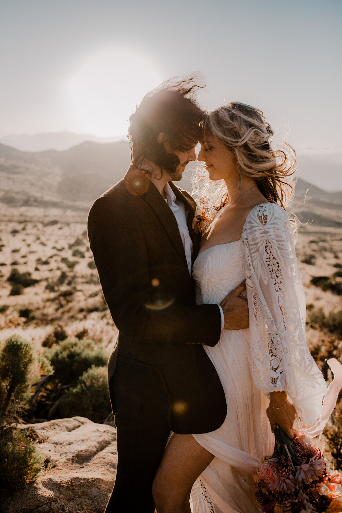 Bride and groom elope on a cliff in Joshua Tree
