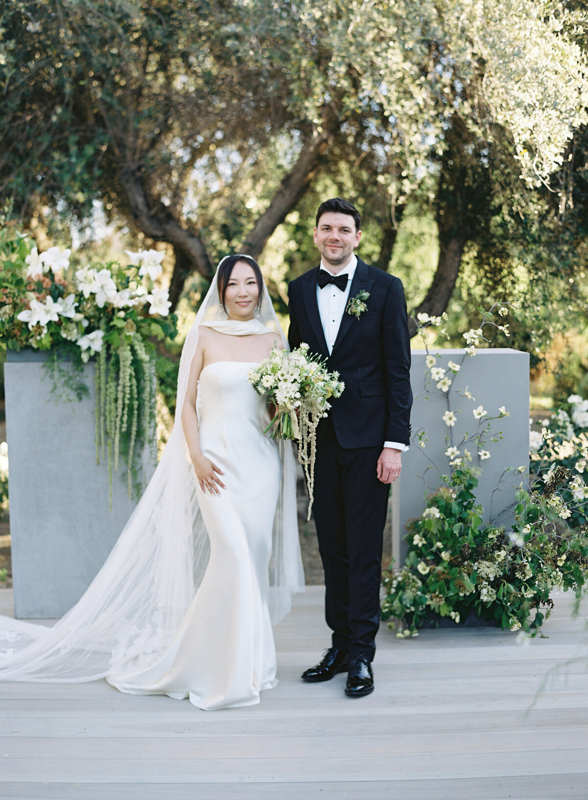 bride-groom-ceremony-alter-outdoor-wedding-napa-valley-floral-arrangements