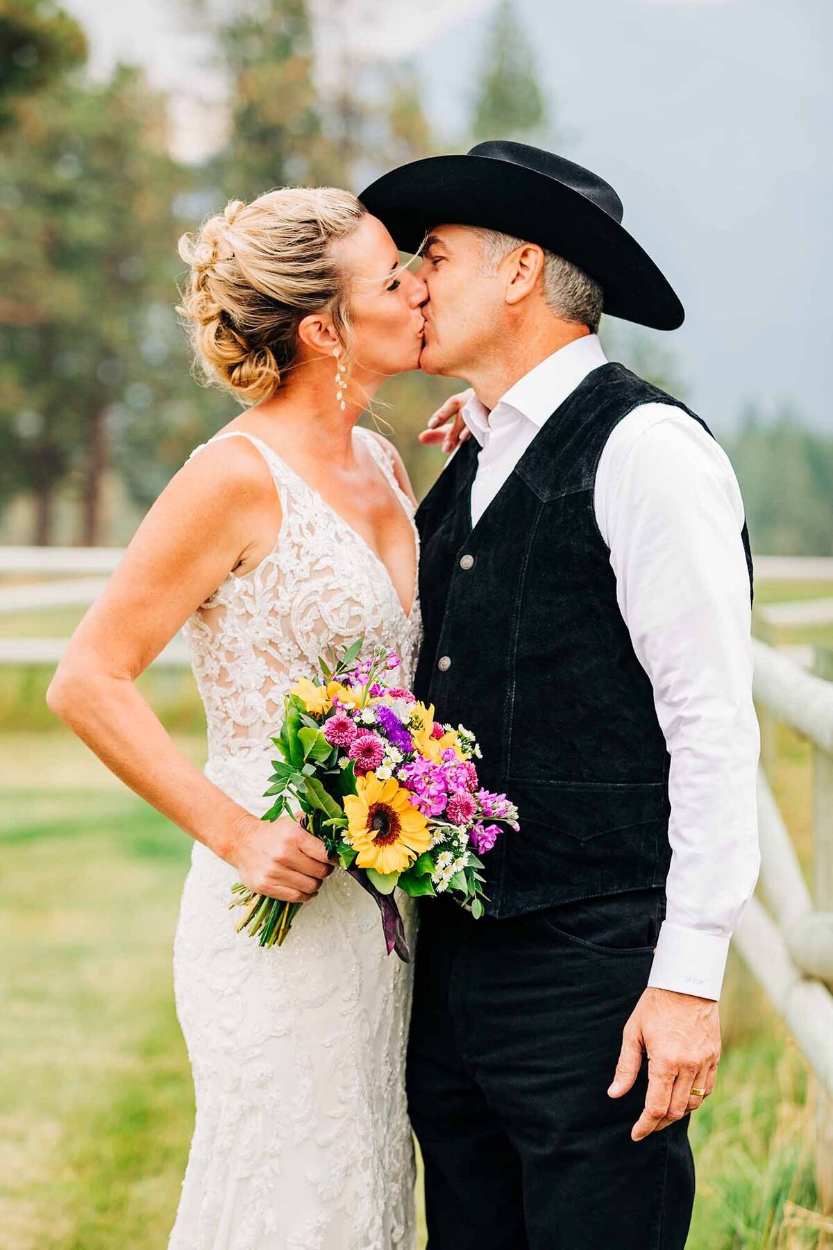 Bride and groom kissing outside, The Silver Knot, Ronan, MT