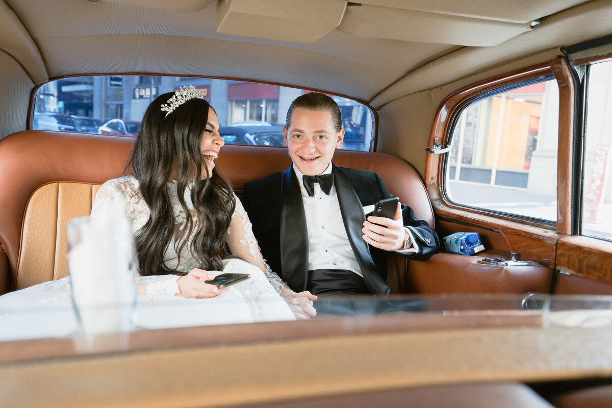 bride and groom in limo