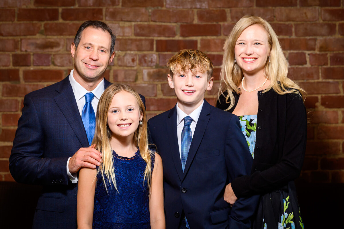 Tyler Lasky poses with his family for formal portraits during his Bar Mitzvah