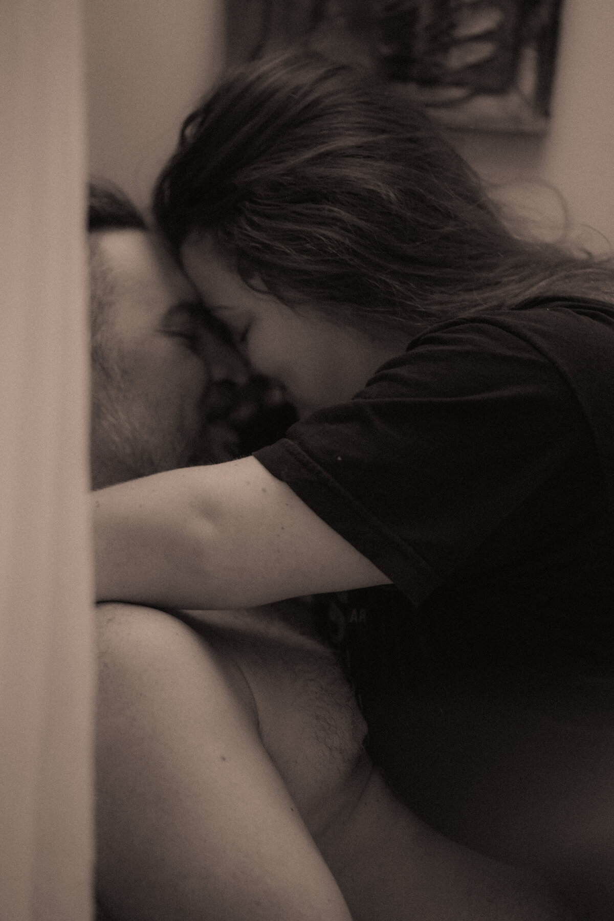 Slow shutter of a couple kissing in a Sewanee Airbnb before their elopement.