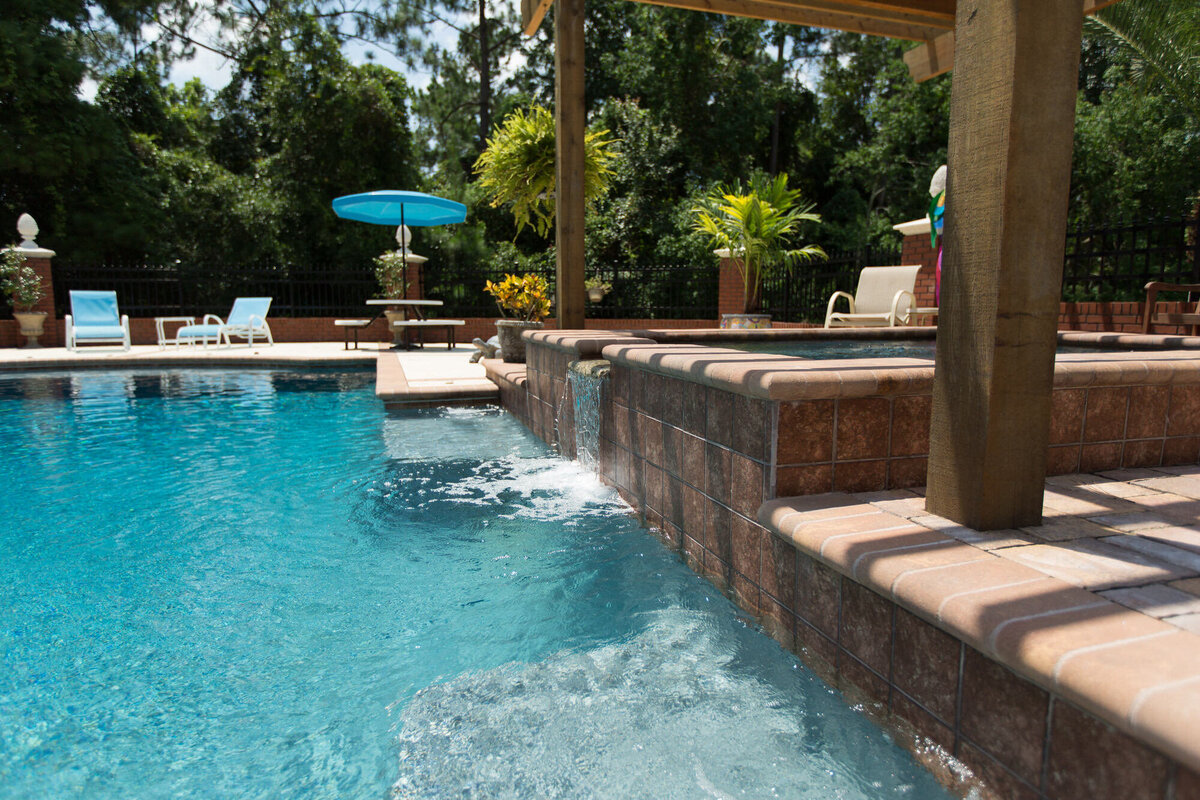 Jacksonville pool builders with spa and water features