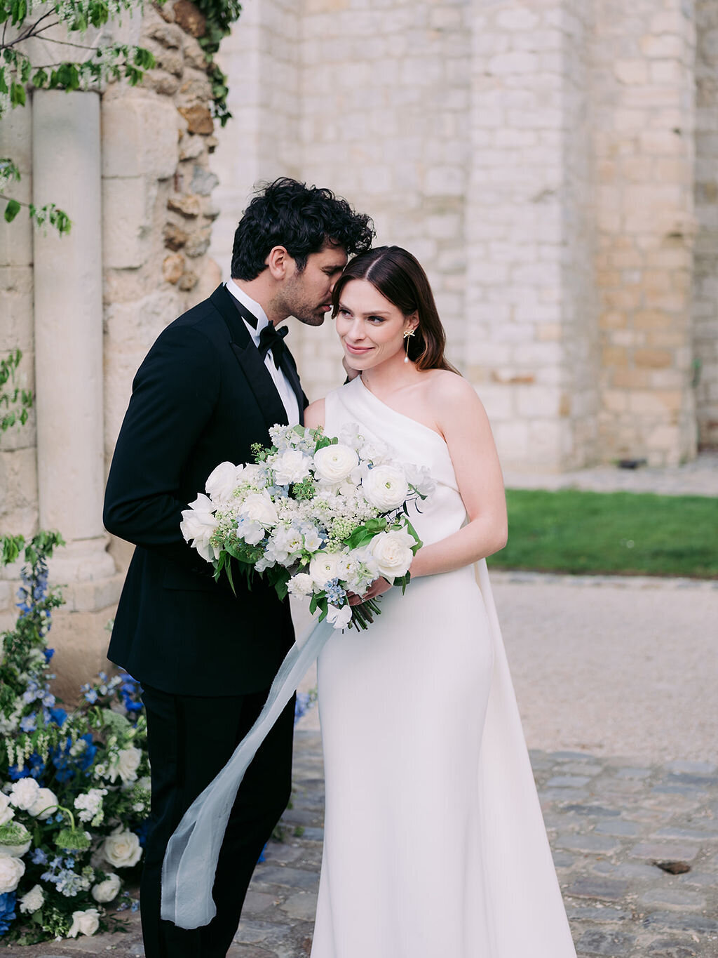 Bride and groom at the ceremony with the magnificent bridal bouquet