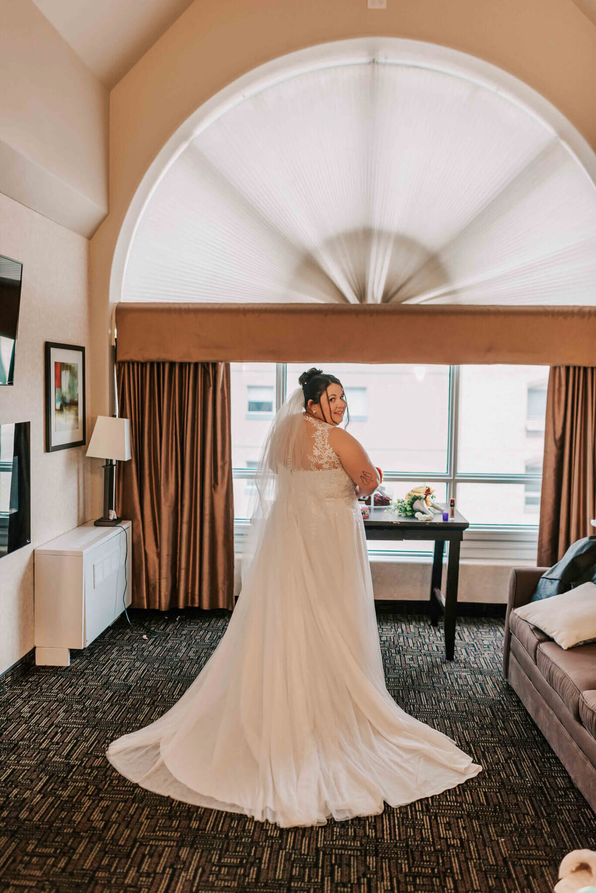 Full length photo of bride in her dress.