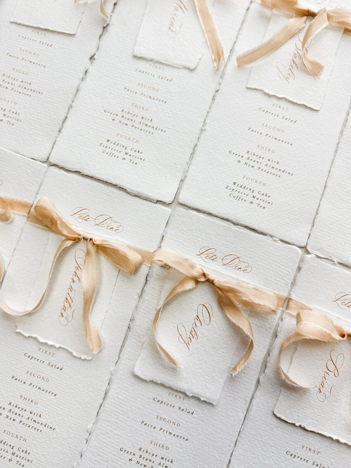 Wedding menus with place card and silk ribbon on handmade paper