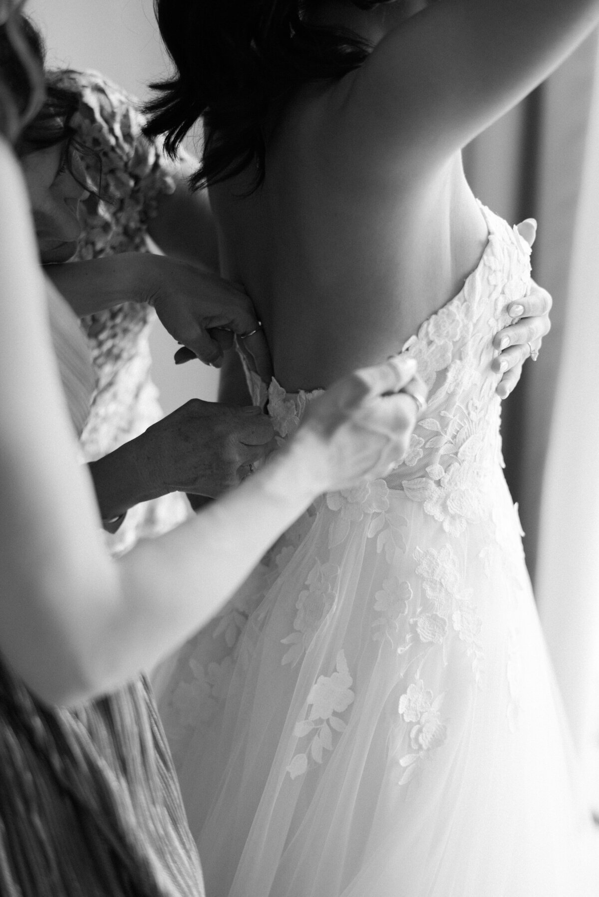 Bridesmaids zip bride's dress