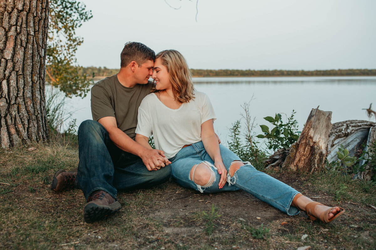 engaged-couple-by-lake