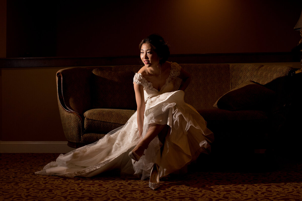 bride putting on shoe