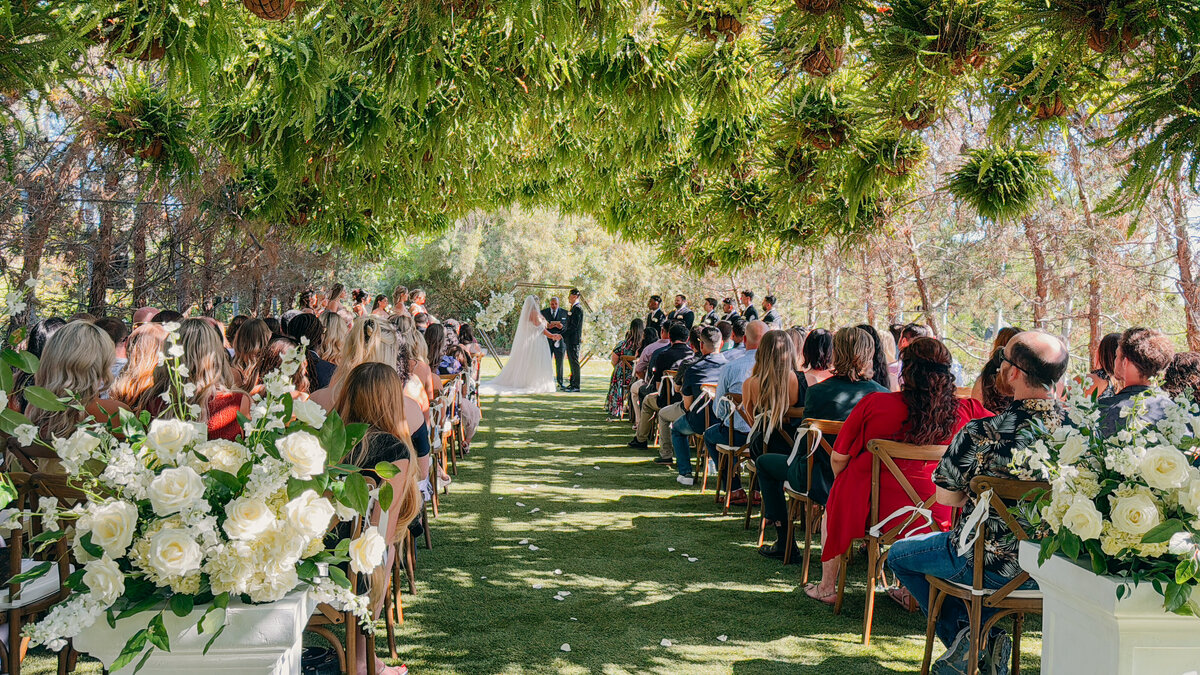 Luxury Wedding in Ethereal Gardens San Diego Bride and Groom holding hands captured by California Wedding content Creator