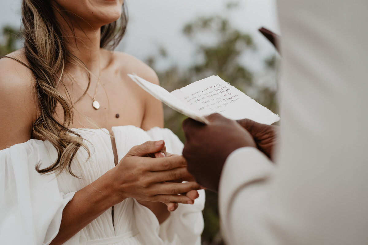 Utah Elopement Photographer captures close up of groom's vow book