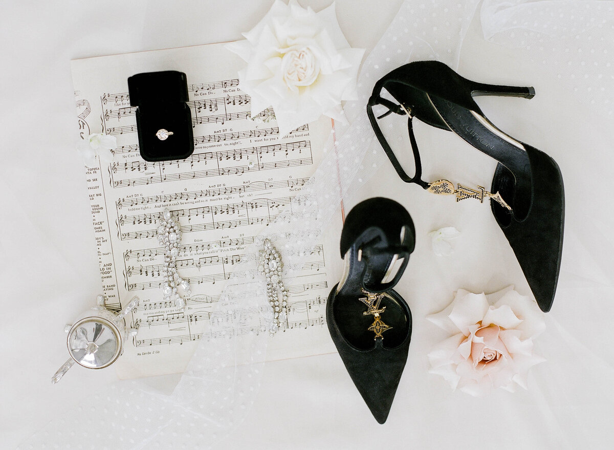 music inspired fine art flatlay with louis vuitton shoes
